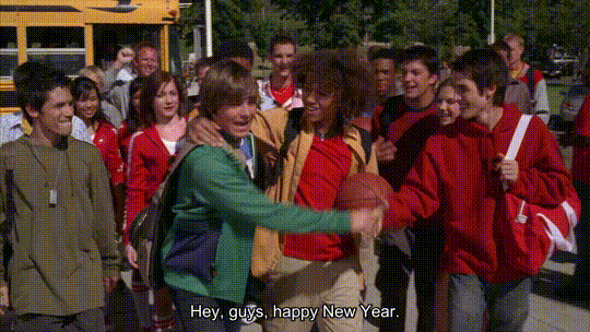 gif from high school musical of troy and chad in a crowd with captions saying "Hey guys, happy New Year. Yeah! It's gonna be a happy... Wildcat New Year, man... Troy, you're the man!"